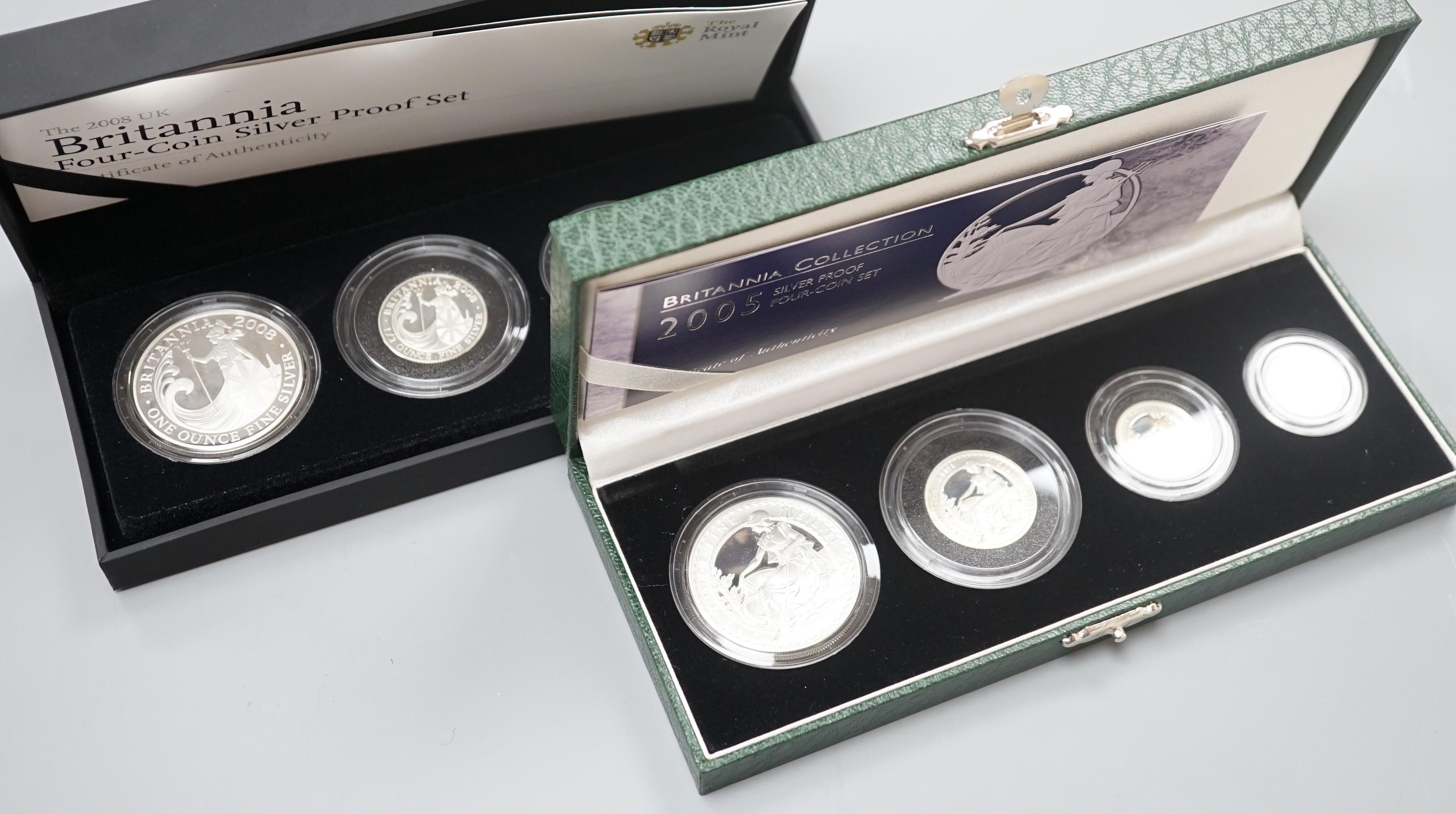 Two cased Royal Mint Britannia silver proof four coin sets, 2005 and 2008, 20p to £2